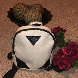 White faux leather purse with black detailing